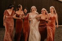 mismatching brown, rust and burnt orange velvet maxi bridesmaid dresses are a great idea for a fall wedding