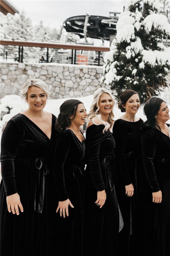 mismatching maxi black velvet bridesmaid dresses with long sleeves are ideal for an elegant winter wedding