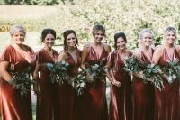 mismatching rust velvet maxi bridesmaid dresses with trains look luxurious and very refined and will match a fall wedding