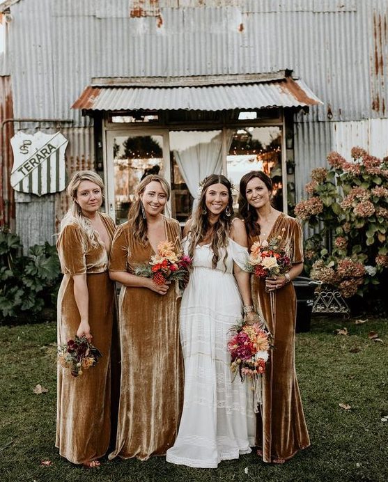 mustard-colored velvet maxi dresses with short sleeves, deep necklines will fit both a fall and winter wedding
