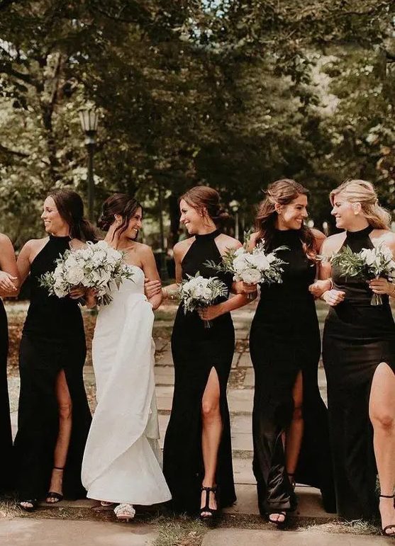 black maxi bridesmaid dresses with halte rnecklines, thigh high slits, black shoes for a super elegant and exquisite weddings