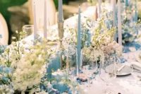 07 a fabulous wedding tablescape done with pastel blooms, pastel blue candles, neutral porcelain and neutral linens for a Bridgerton wedding