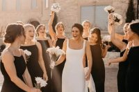 11 matching black maxi bridesmaid dresses with high necklines and spaghetti straps are gorgeous for a modern wedding
