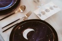 27 a celestial wedding tablescape with purple and gold porcelain, moons, stars and black and gold cutlery