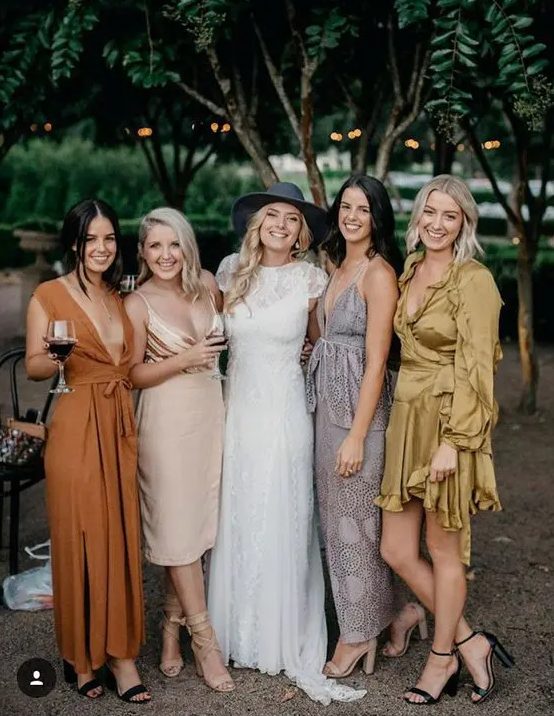 mismatching bridesmaid dresses in mustard, rust, blush and grey, with and without ptints are awesome