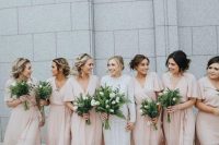 36 tender blush wrap maxi bridesmaid dresses with high low skirts, V-necklines and short sleeves