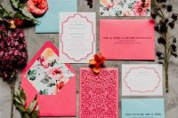 37 a bright wedding invitation suite in pink, light blue and with floral prints and laser cut is amazing and fun