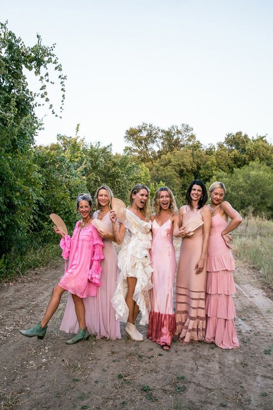 mismatching short and maxi pink bridesmaid dresses with various kinds of detailing and silhouettes