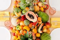 45 a super lush table runner of every kind of tropical fruit wows and can be eaten by the guests