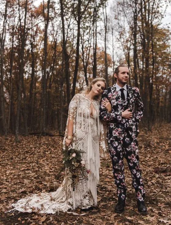 a moody floral print three-piece wedding suit, a black tie and a white shirt, black shoes
