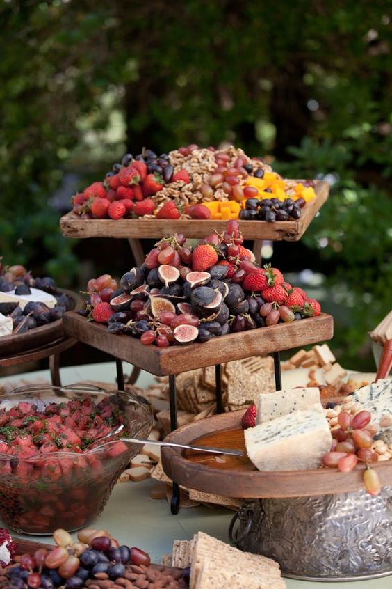 a gorgeous fruit, nuts and cheese wedding station is a cool idea for any wedding, whatever the season is