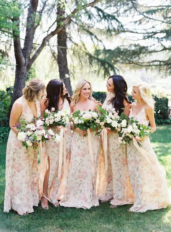 subtle mismatched watercolor floral print bridesmaids' dresses with various cuts and necklines for a spring wedding