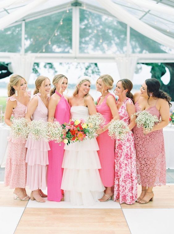 mismatching pink midi and maxi bridesmaid dresses including ruffle, lace and floral print ones