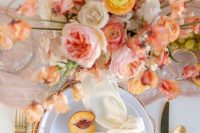 a beautiful coral and orange wedding place setting wiht peachy touches, a peachy card and a creamy napkin is wow
