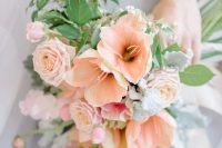 a beautiful peachy and white bloom wedding bouquet with greenery and lily of the valley is romantic