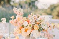 a beautiful peachy wedding centerpiece of peachy, yellow, white blooms is a lovely and catchy idea to rock