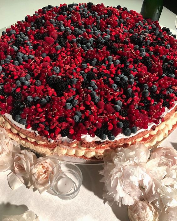 a classic millefoglie wedding cake topped with a whole ton of berries is adorable, it looks and tastes amazing