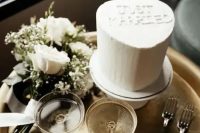 a classic white heart-shaped wedding cake is a cool idea for 2024 and not only, such styling is always on