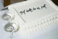 a classy white lambeth sheet wedding cake with calligraphy includes two different trends, sheet and lambeth