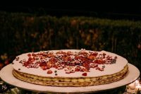 a cool oval sheet wedding cake topped with fresh berries is a lovely idea for a wedding