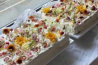 a duo of sheet wedding cakes topped with fresh berries and bright blooms is amazing for a summer wedding