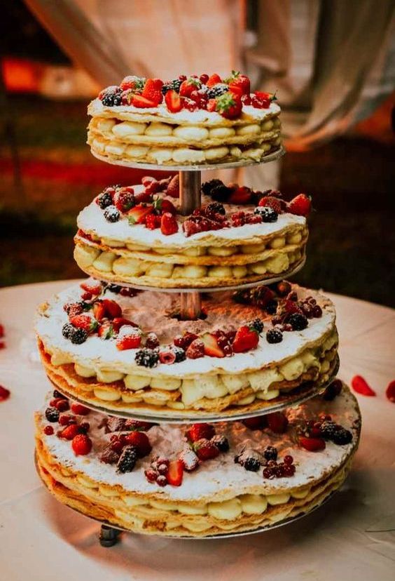 a fab tiered round millefoglie topped with fresh berries is a cool alternative to a usual wedding cake