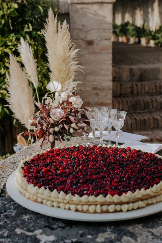 a gorgeous millefoglie topped with cherries, blueberries and raspberries is a gorgeous idea for a boho wedding