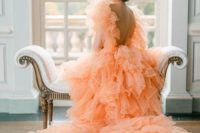 a gorgeous ruffle Peach Fuzz wedding gown with an open back and cap sleeves is amazing