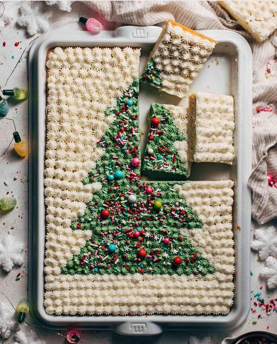 a gorgeous sheet wedding cake with a Christmas tree painted on top and colorful beads is adorable for a Christmas wedding