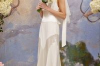 a modern wedding dress with a sheer skirt and a veil plus a scarf is a super creative solution for a modern bride