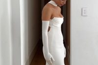 a sexy strapless wedding dress with a corset bodice, a scarf and long gloves plus white shoes for a trendy look