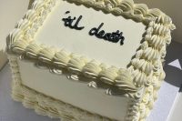 a small and cool sheet white wedding cake with chocolate calligraphy is great for an elopement or a small wedding