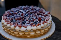 a small, chic and delicious millefoglie wedding cake topped with meringues and fresh berries is amazing for a small wedding