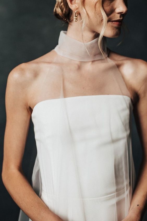 a strapless wedding dress paired with a sheer tan scarf as a delicate accent are a lovely combo