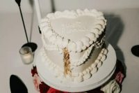 a white heart-shaped lambeth wedding cake with calligraphy is a lovely idea for a modern glam wedding
