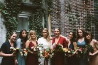 all-different boho bridesmaids’ dresses in blue, navy, red, burgundy and light blue