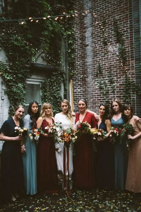 all-different boho bridesmaids' dresses in blue, navy, red, burgundy and light blue