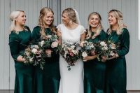 beautiful matching dark green midi bridesmaid dresses with high necklines and long sleeves plus silver shoes