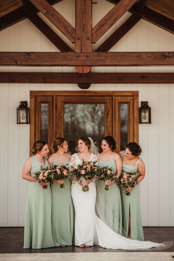 beautiful sage green maxi bridesmaid dresses with mismatching necklines are chic for spring or summer