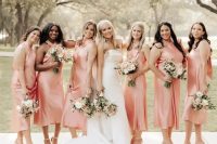 bridesmaid wearing matching Peach Fuzz midi stain dresses with halter necklines and strappy heels