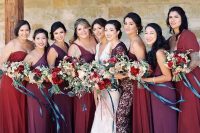 bridesmaids’ dresses in the shades of red, purple, burgundy, all different and of different fabrics
