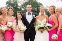 bridesmaids wearing light pink, hot pink and dusty pink mismatching maxi dresses look fantastic and trendy