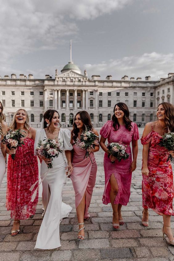 bright pink and red floral and plain midi bridesmaid dresses are amazing for a pink and floral wedding in spring or summer