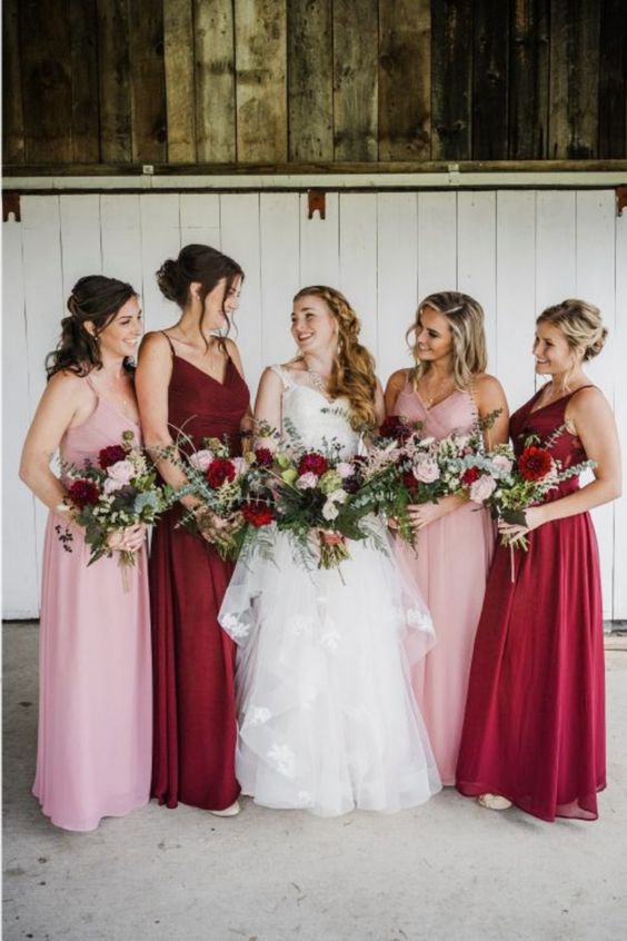 burgundy and pink maxi bridesmaid dresses are mismatching and very bright, great for a pink and burgundy wedding