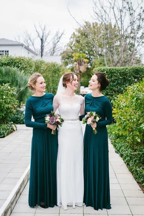chic emerald draped bridesmaids' dresses with long sleeves for a modest look at a winter wedding