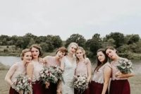 chic fall bridesmaid outfits with neutral cap sleeve lace crop tops and burgundy tulle maxi skirts plus a bold lip