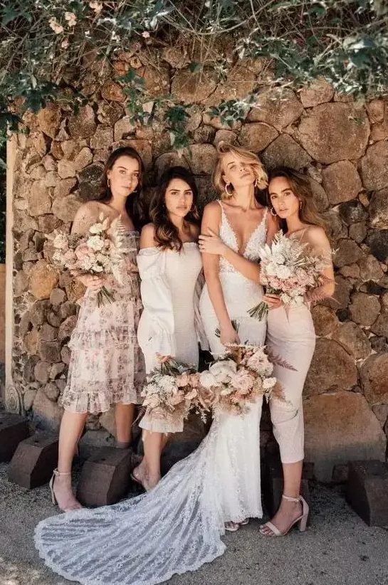 chic mismatching neutral bridesmaid dresses of midi length in blush and creamy plus nude shoes are spring or summer perfection