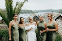 classy mismatching green bridesmaid dresses with mismatching necklines are great for a tropical wedding