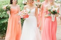 coral, orange and peachy pink maxi bridesmaid dresses of mismatching designs and with draped skirts are great