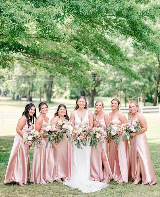 delicate blush maxi satin slip bridesmaid dresses with slits are great for spring and summer weddings